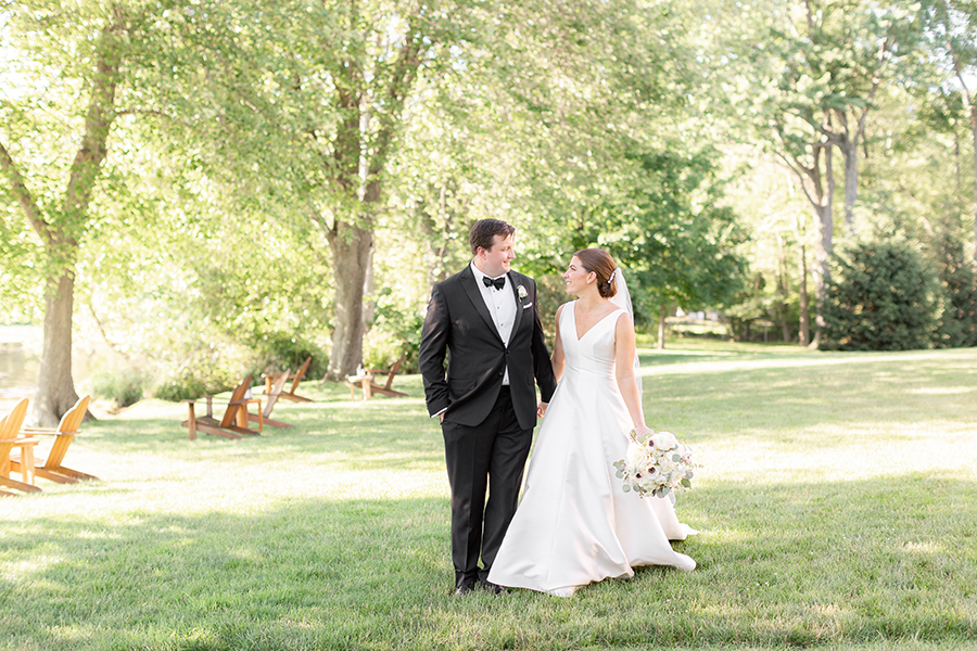 bride and groom holding hands at Indian Trail Club Wedding | Idalia Photography